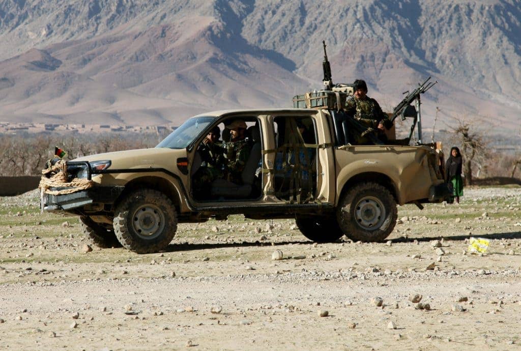 Members of the Afghan National Army prepare to conduct a routine patrol in the Oruzgan province of Afghanistan. US officials claim Russia is supplying arms to the Taliban in that region.