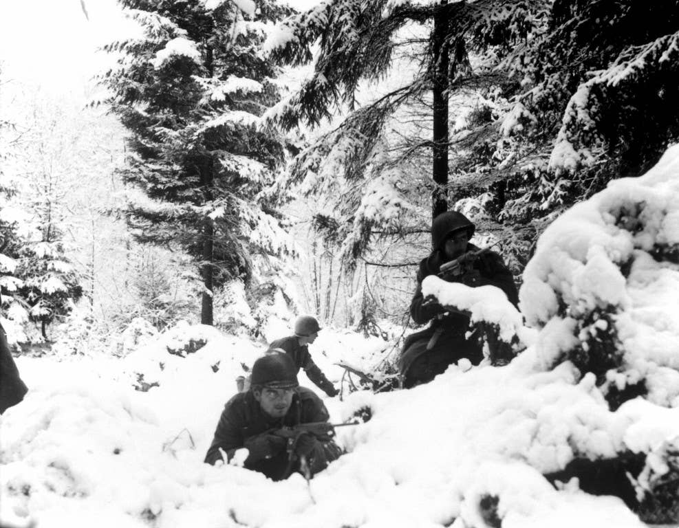 American infantrymen of the 290th Regiment fight in fresh snowfall near Amonines, Belgium on Jan. 4, 1945. (Photo: U.S. Army)