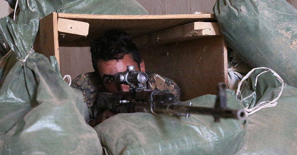 An Iraqi army soldier fires an SVD-63 Dragunov sniper rifle during training. (Photo from US Military)