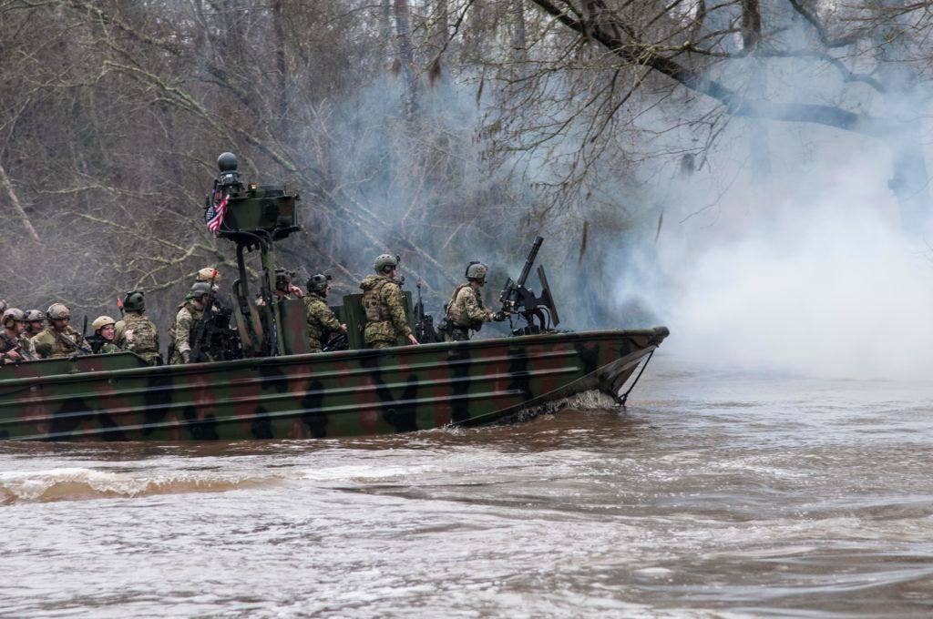 Members of Special Boat Team 22 participate in a Special Operations Craft Riverine demonstration at the Naval Small Craft Instruction and Technical Training School. (U.S. Navy photo by Mass Communication Specialist Seaman Richard Miller/Released)