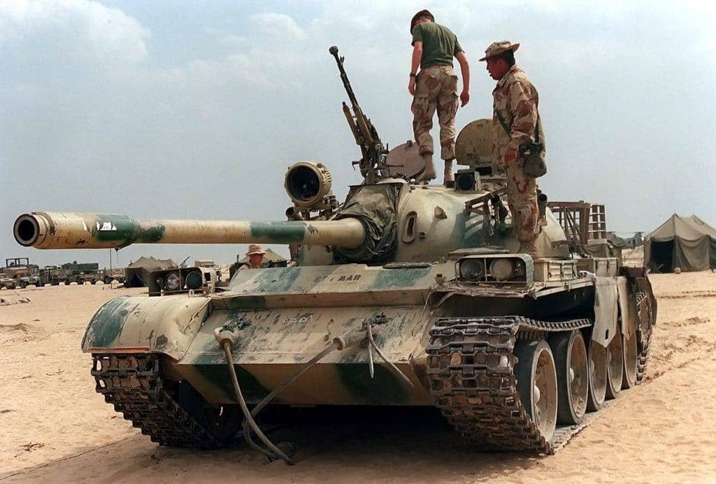 Marines look over a captured Iraqi Type 69 tank. (DOD photo)