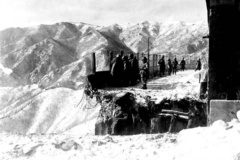 This blown bridge at Funchilin Pass blocked the only way out for U.S. and British forces withdrawing from the Chosin Reservoir in North Korea during the Korean War. Air Force C-119 Flying Boxcars dropped portable bridge sections to span the chasm in December 1950, allowing men and equipment to reach safety. (U.S. Air Force photo)