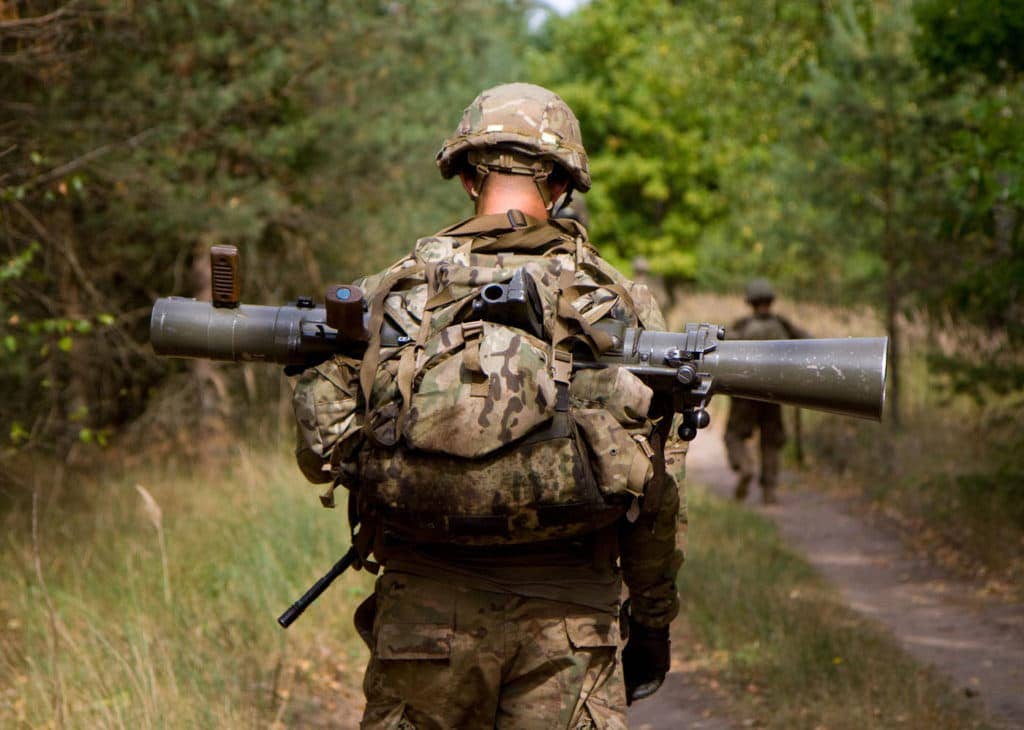 United States Army Spc. Craig Loughry, a 24-year-old native of Kent, Ohio, assigned to Dog Company, 1st Battalion, 503rd Infantry Regiment, 173rd Airborne Brigade, has the unenviable task of carrying his squad's Carl Gustav M2CG recoilless rifle. (Photo: U.S. Army Sgt. James Avery)