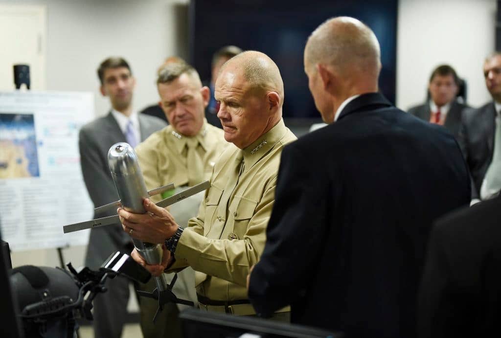 Commandant of the Marine Corps, Gen. Robert Neller, is briefed on the Advanced Capability Extended Range Mortar (ACERM) during an Office of Naval Research (ONR) awareness day. The ACERM uses dual-mode guidance, advanced aerodynamics and improved propellants to increase the performance significantly beyond that of current systems. (U.S. Navy photo by John F. Williams)