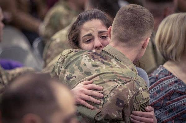 A couple hug before the last group of the 16th Combat Aviation Brigade Soldiers deploy for Afghanistan at Joint Base Lewis-McChord Sunday. The Raptor Brigade has deployed about 800 Soldiers in support of Operation Freedom's Sentinel with U.S. Forces Afghanistan.