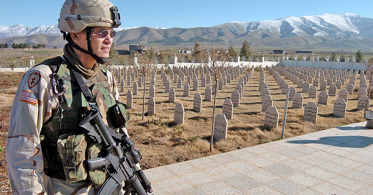 1st Lt. Matthew Chau, Border Team 3 OIC with HHS, TF 2-11 FA, stares out onto a mass grave site of the victims in the 1988 gas attack in Halabja on Jan. 12. (Sgt. Sean Kimmons)
