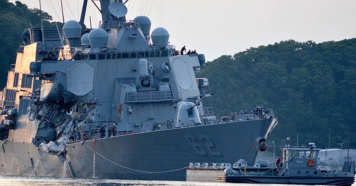 The Arleigh Burke-class guided-missile destroyer USS Fitzgerald (DDG 62) returns to Fleet Activities (FLEACT) Yokosuka following a collision with a merchant vessel while operating southwest of Yokosuka, Japan. (U.S. Navy photo by Mass Communication Specialist 1st Class Peter Burghart/Released)