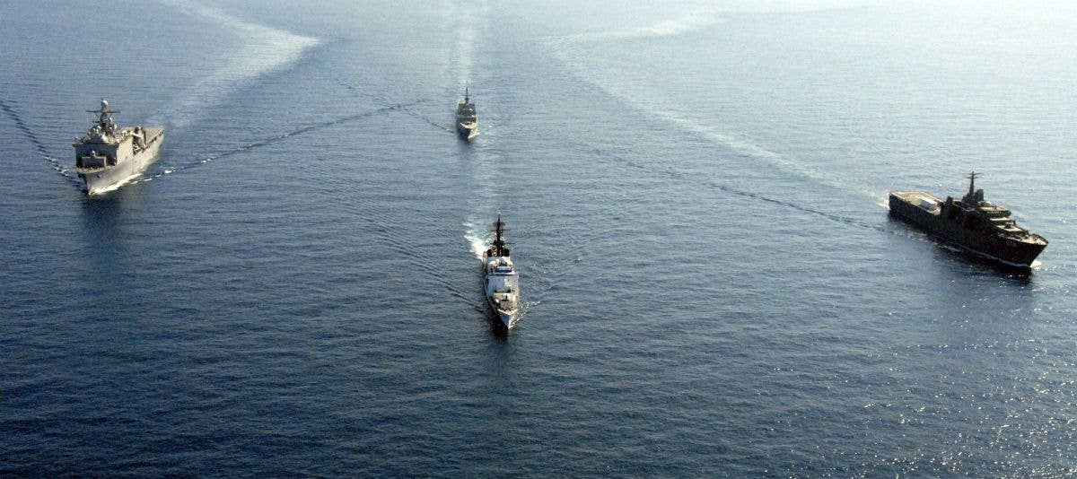US Navy and Republic of Singapore ships in the South China Sea. US Coast Guard photo by Public Affairs Specialist 3rd Class Angela Henderson
