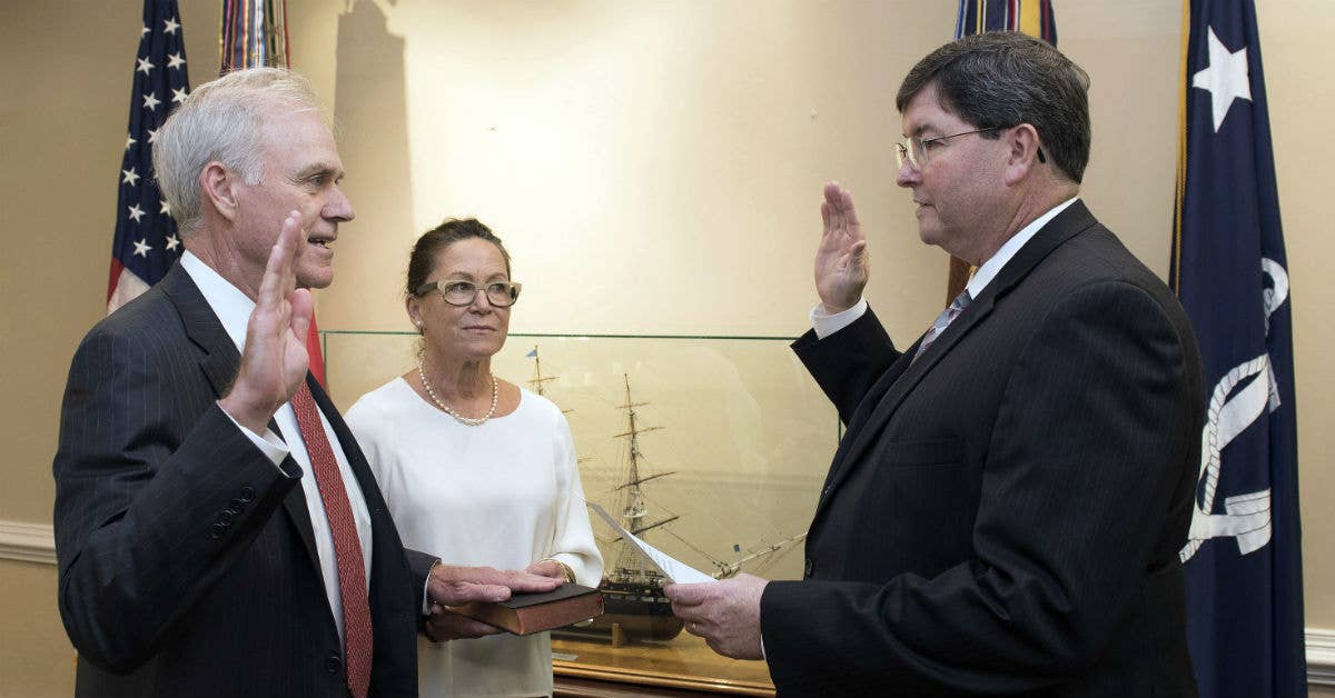 Richard V. Spencer is sworn in as the 76th Secretary of the Navy by William O'Donnell, Department of the Navy administrative assistant. Navy photo by Mass Communication Specialist 2nd Class Jonathan B. Trejo.