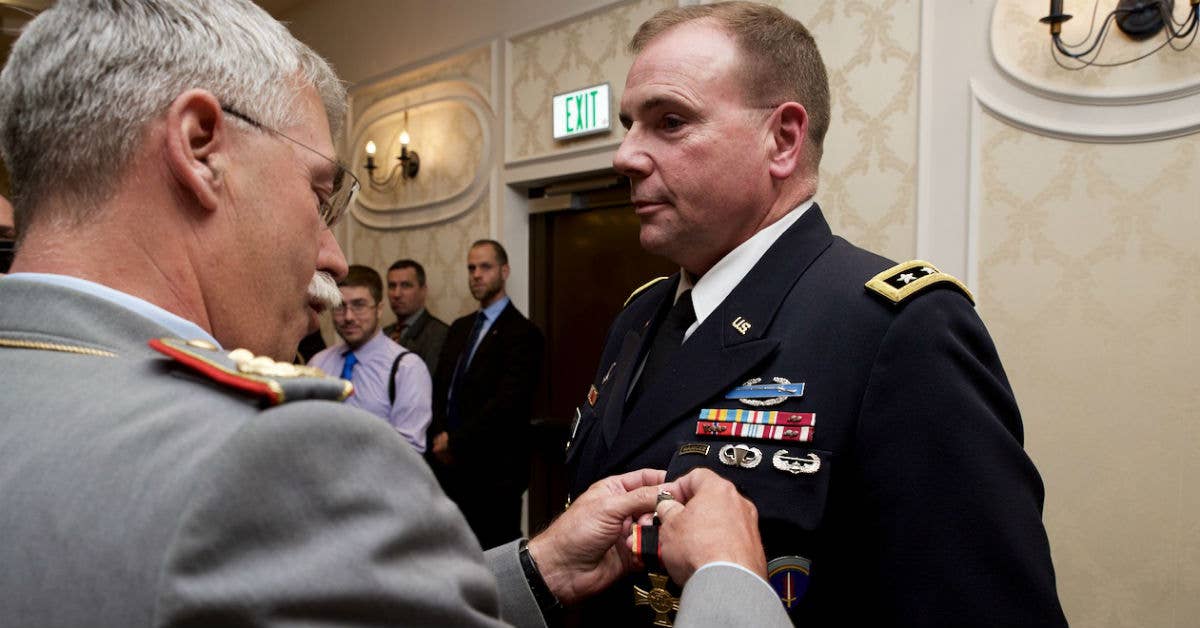 Lt. Gen. Ben Hodges, commander, US Army Europe, is awarded the German Federal Armed Forces Golden Cross of Honor by German Lt. Gen. Joerg Vollmer, the chief of staff of the German Army. Photo courtesy of US Army.