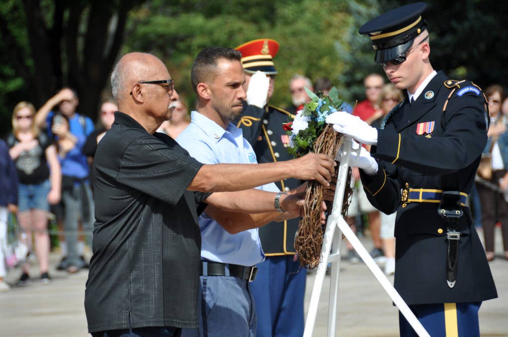 Vietnam War veteran and Guitars for Vets volunteer James Robledo places a wreath at the Tomb of the Unknown Soldier. (Guitars for Vets photo)