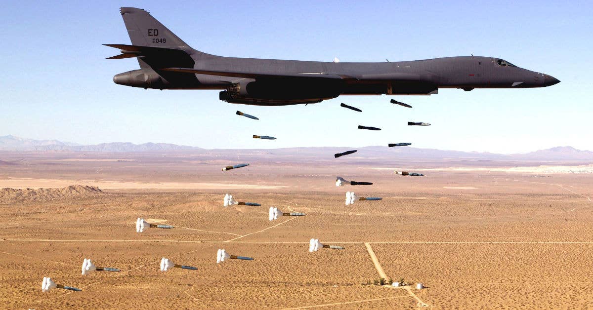 A B-1B Lancer releases its payload. There's a lot of bombs there. (USAF photo by Steve Zapka.)