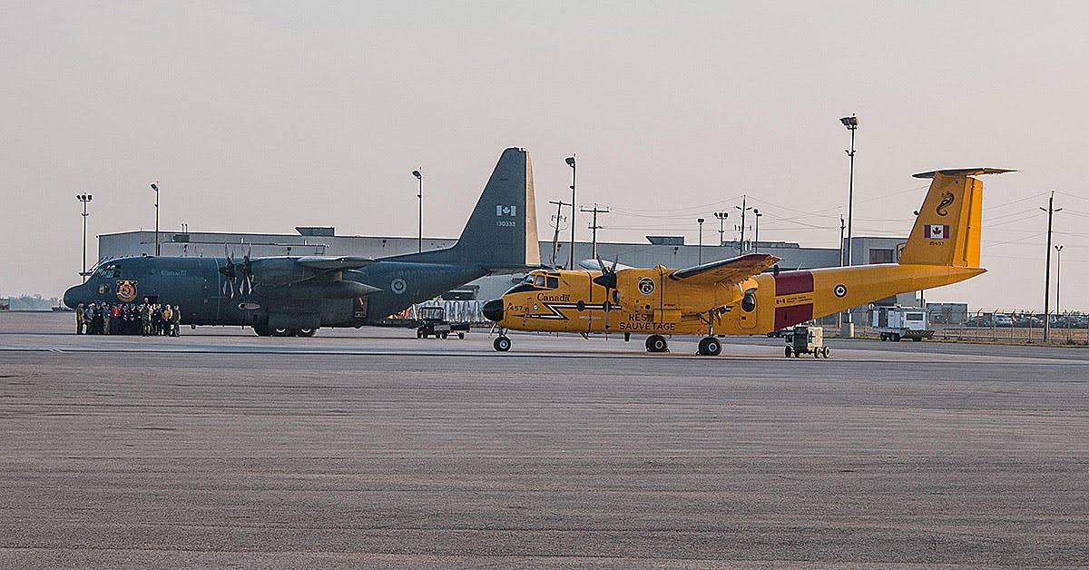 A CC-130H Hercules and CC-115 Buffalo (right) sit side by side before a training sortie (Photo Ian D'Costa)