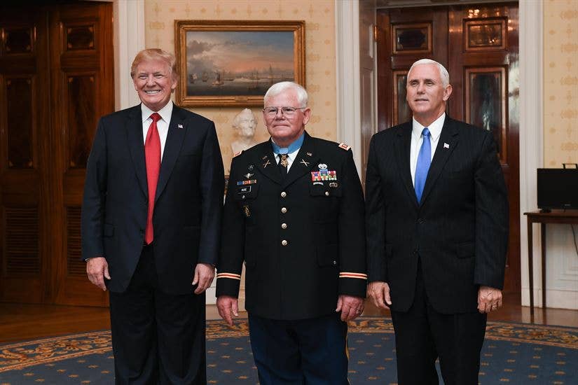 President Donald J. Trump, retired Army Capt. Gary M. Rose and Vice President Mike R. Pence pose for a photo after Rose received the Medal of Honor in a ceremony at the White House, Oct. 23, 2017. Army photo by Spc. Tammy Nooner