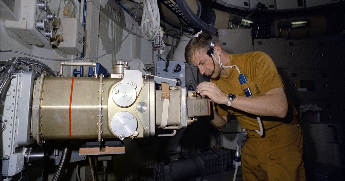 NASA Astronaut Paul J. Weitz, pilot of the Skylab 2 mission, works with the UV Stellar Astronomy Experiment S019 during Skylab training at the Johnson Space Center in Houston, Texas, March 1st, 1973. Photo courtesy of NASA.