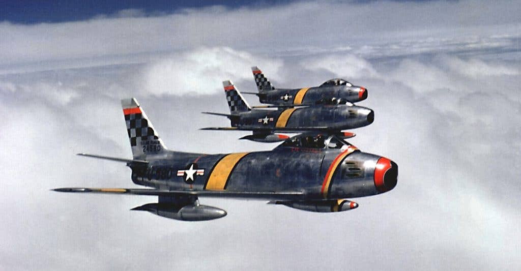 A flight of F-86 Sabres over Korea led by Benjamin O. Davis. Their battery consisted of six M3M machine guns, known today as the GAU-21. (USAF photo)
