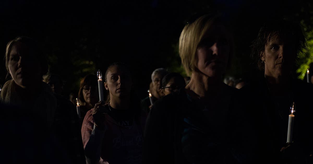 Women from the National Guard hold candlelights during a remembrance ceremony for all the women servicemembers who have died in the line of duty, Oct. 21, 2017, at the Women in Military Service for America Memorial at Arlington Cemetary in Washington D.C. US Air National Guard photo by Staff Sgt. Kasey Phipps