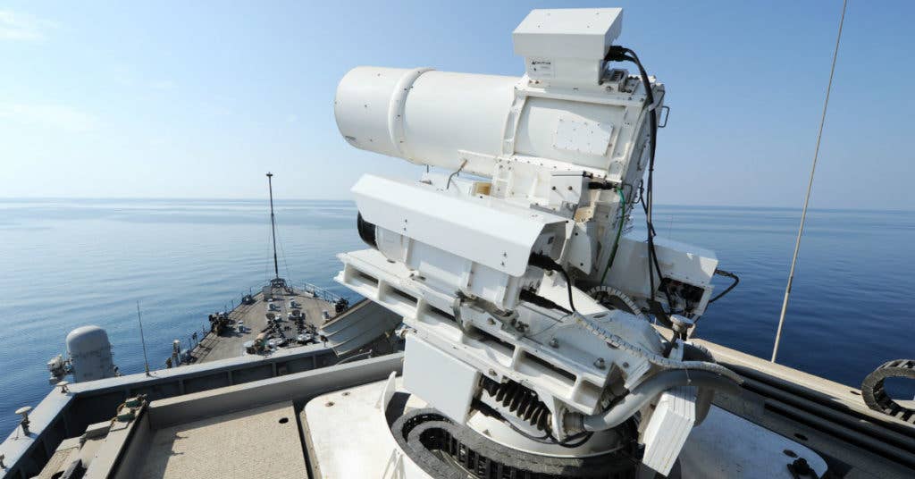 USS Ponce conducts an operational demonstration of the Office of Naval Research-sponsored Laser Weapon System. (Navy photo by John F. Williams.)