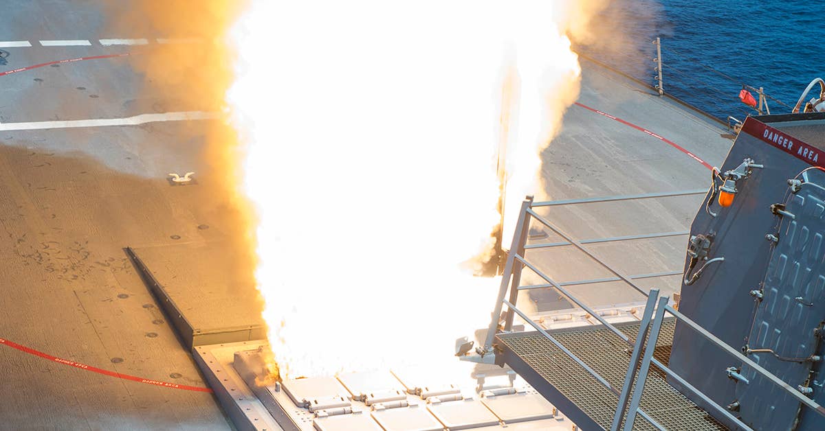 USS Arleigh Burke (DDG 51) successfully launches an SM-2 Standard Missile from the forward Vertical Launching System as part of their Combat System Ship Qualification Trials. Navy photo by Mass Communication Specialist Seaman Maria I. Alvarez.