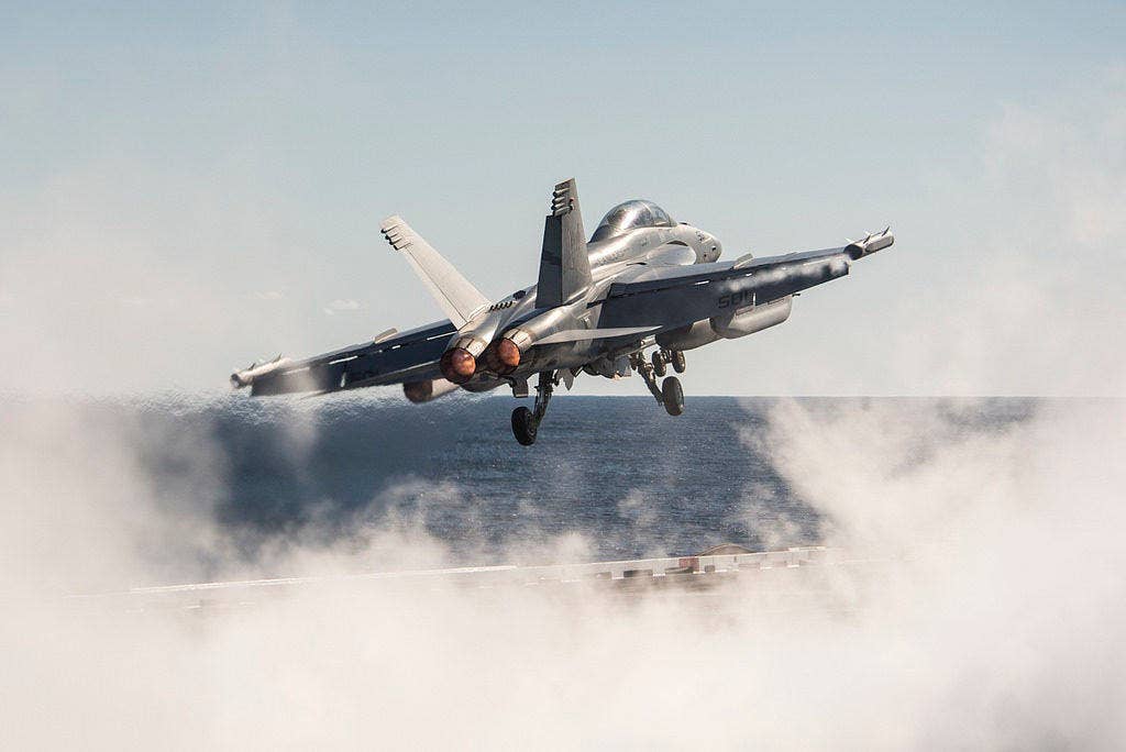 An E/A-18G Growler assigned to the Lancers of Electronic Attack Squadron (VAQ) 131 launches from the aircraft carrier USS George H.W. Bush (CVN 77). The ship's carrier strike group is conducting naval operations in the U.S. 6th Fleet area of operations in support of U.S. national security interests. (U.S. Navy photo by Mass Communication Specialist 3rd Class Christopher Gaines/Released)