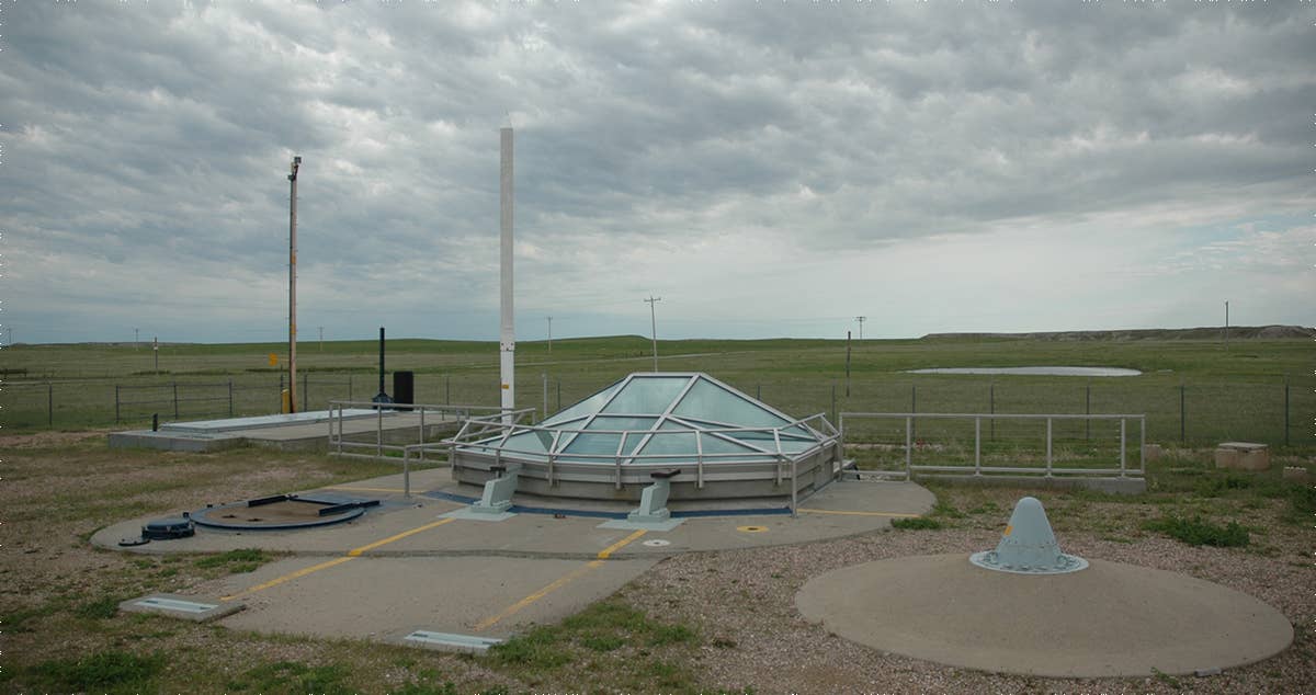 There were 150 silos located in South Dakota during the Cold War. They were man-less sights surrounded by 8 foot cyclone fences topped with barbed wire. Inside concrete and metal structures housed and protected the Minuteman missiles. This is Delta-09 at the Minuteman Missile National Historic Site. Photo from National Park Service.