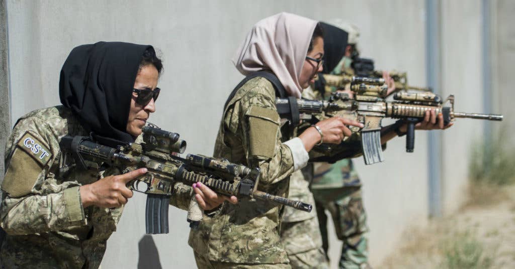 Ktah Khas Afghan Female Tactical Platoon members perform a close quarters battle drill drill outside Kabul, Afghanistan May 29, 2016. Air Force photo by Staff Sgt. Douglas Ellis.
