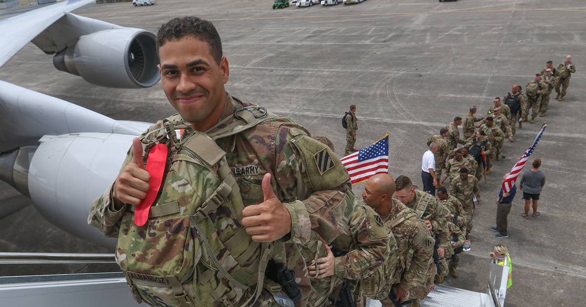 A US Army Soldier, assigned to the 3rd Infantry Division, gives two thumbs up as he boards a plane at Fort Stewart, Ga., Aug. 3, 2017, for a nine-month deployment to Afghanistan. Army photo by Staff Sgt. Candace Mundt
