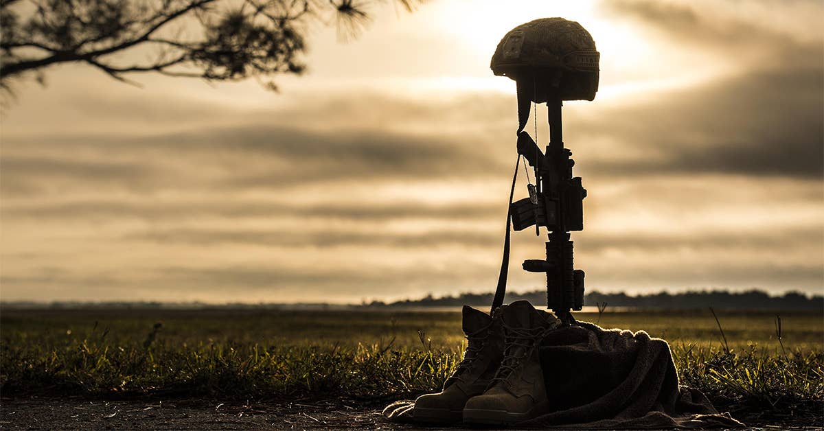 A battle cross sits on display during sunrise, April 15, 2016, at Avon Park Air Force Range, Fla. USAF Photo by Senior Airman Ryan Callaghan.