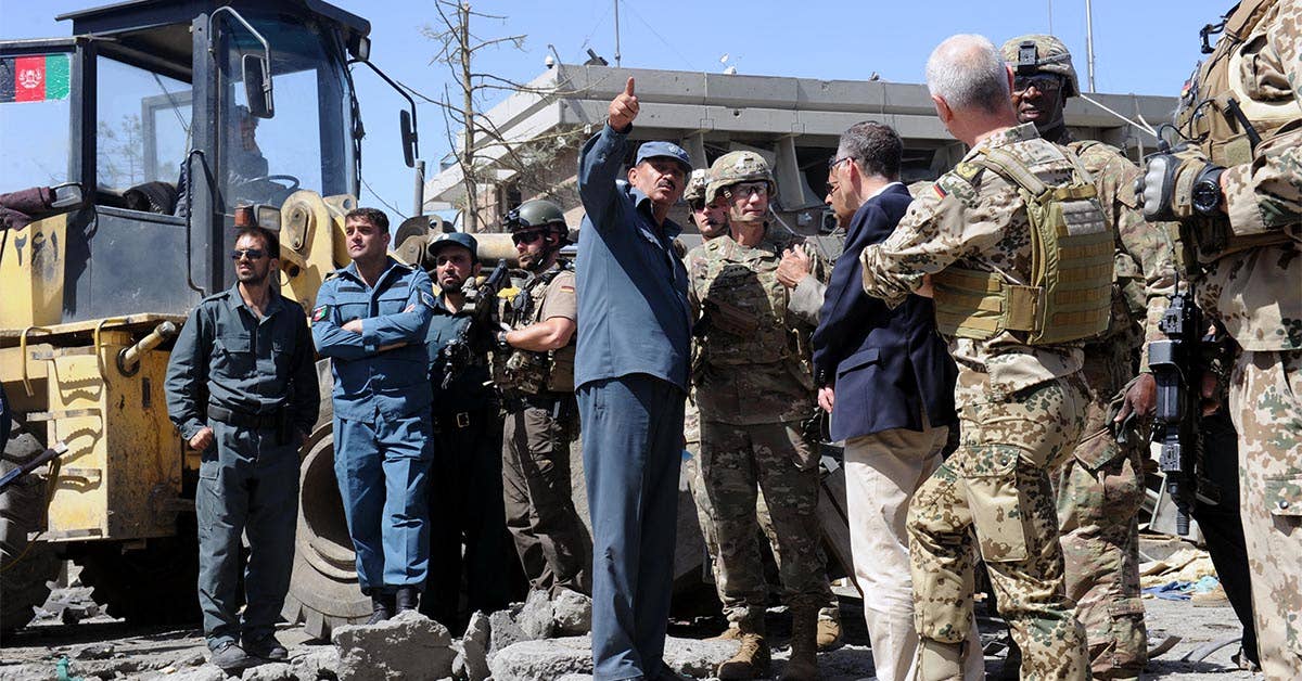 General John Nicholson, Resolute Support commander, RS Chief of Staff Lieutenant General Jurgen Weigt, and RS Command Sergeant Major David M. Clark visit the blast site after the deadly attack on the German Embassy in Kabul. Navy photo by Lt. j.g. Egdanis Torres Sierra.