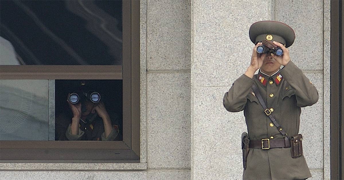 Soldiers from the Korean People's Army look south while on duty in the Joint Security Area. Army photo by Edward N. Johnson.
