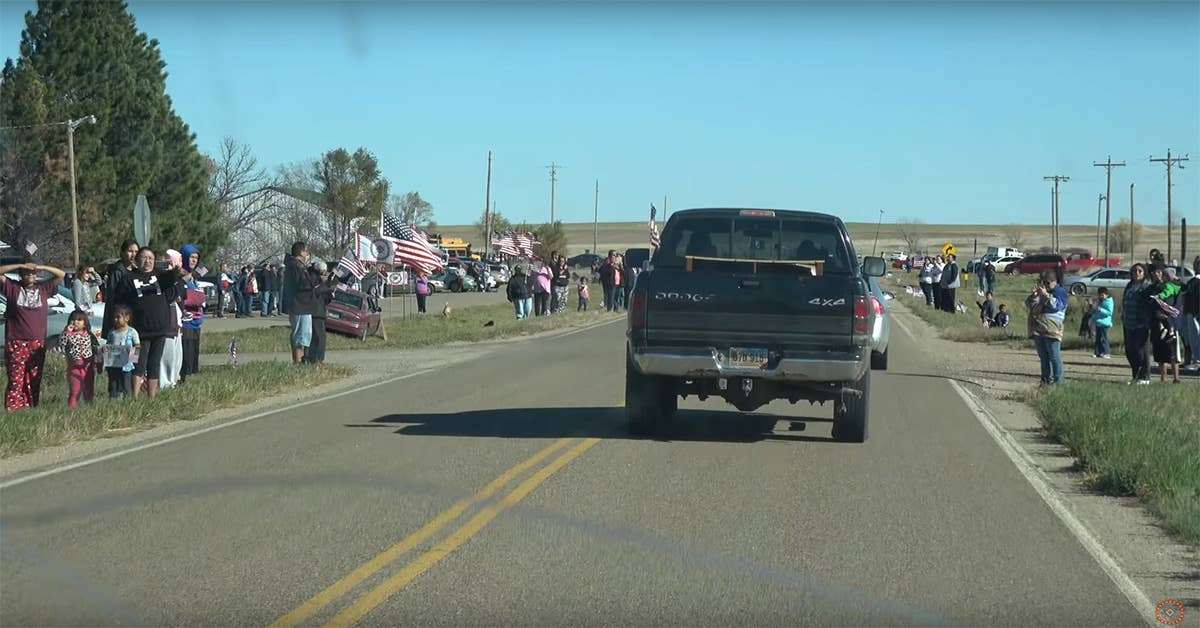 The procession for Sgt. Iyotte rides through Wanblee, South Dakota. Screengrab from a Rosebud Sioux Tribe YouTube video.