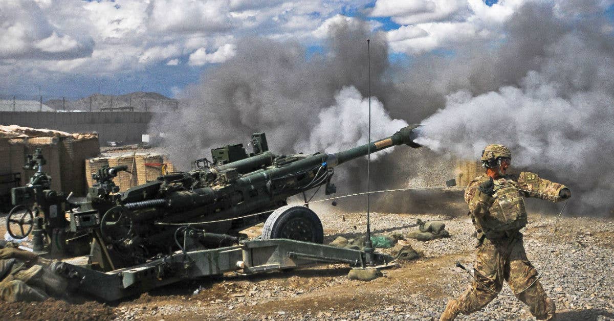 Pfc. Erik Park from San Mateo, Calif., fires his M777 155 mm howitzer at Forward Operating Base Orgun-E Sept. 3, 2011. Photo by Spc. Ken Scar.