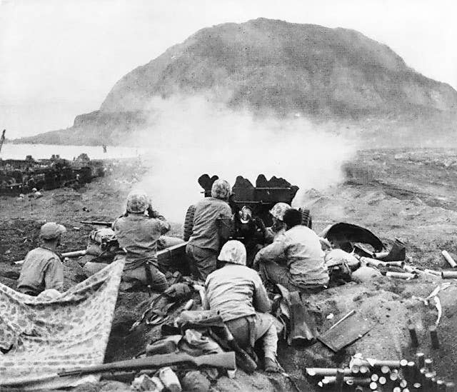 A 37mm anti-tank gun is used against Japanese fortifications. (Photo: US Marine Corps)