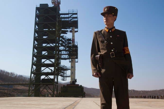 A North Korean soldier stands guard at a missile test site.