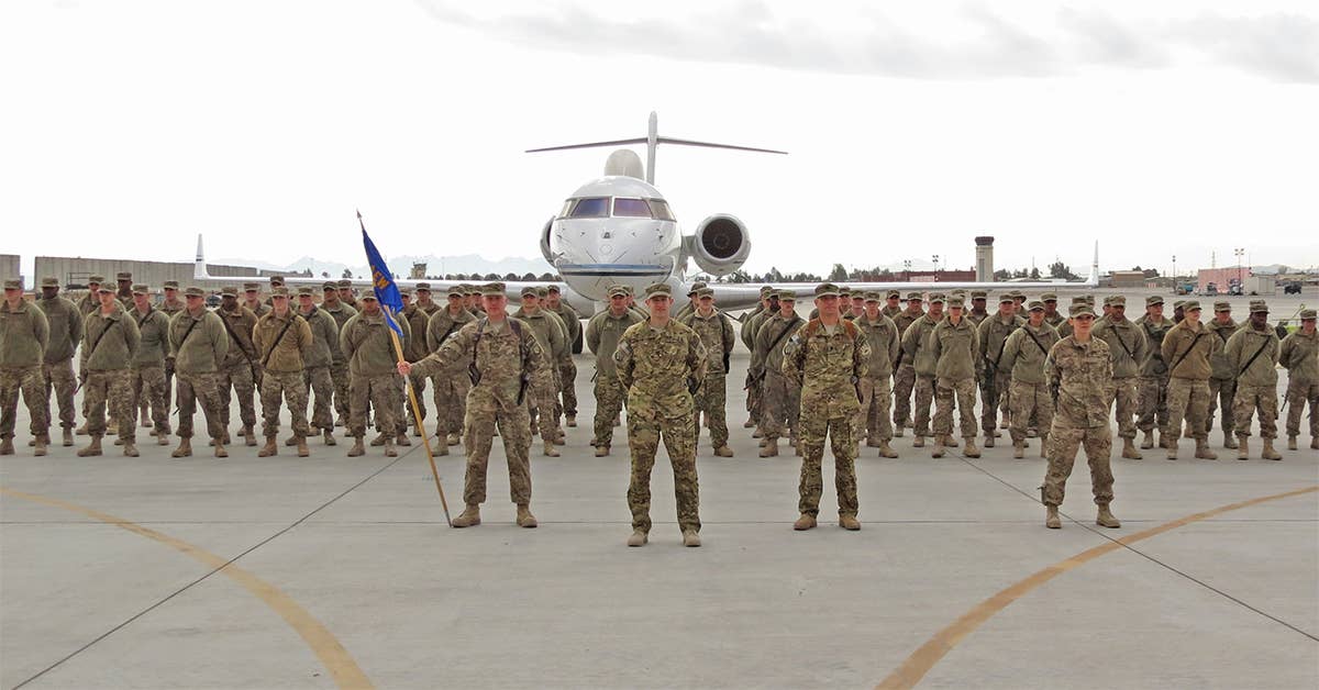 Airmen from the 451st Air Expeditionary Group stand in formation during a transition ceremony at Kandahar Airfield, Afghanistan, Jan. 13, 2014. (U.S. Air Force photo by Staff Sgt. Joseph Needham)