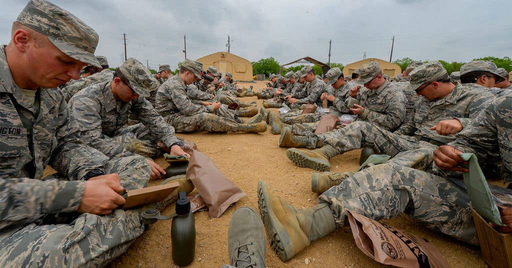 The Air Force takes a moment to chow down on their issued MREs.