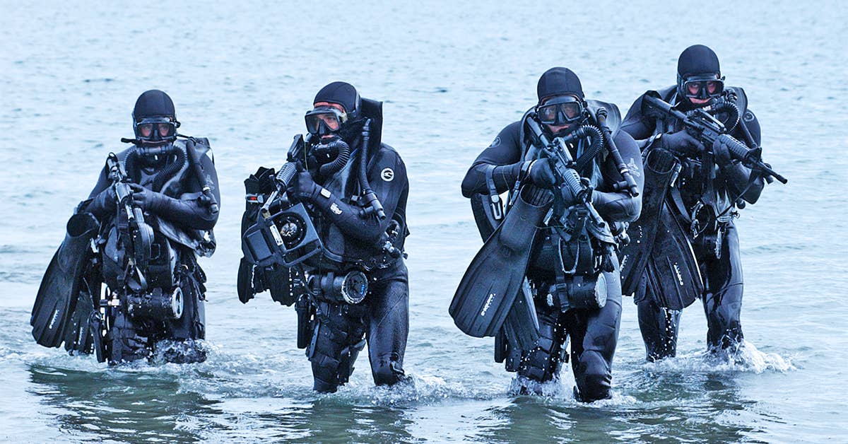 U.S. Navy SEALs storm the beach during a training exercise. (Photo from U.S. Navy)
