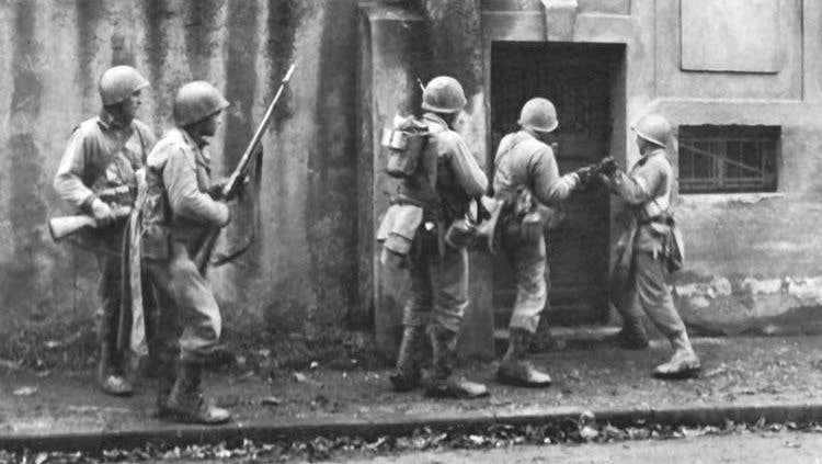 Troops of 5th Infantry Division conducting a house-to-house search in Metz on Nov. 19, 1944.