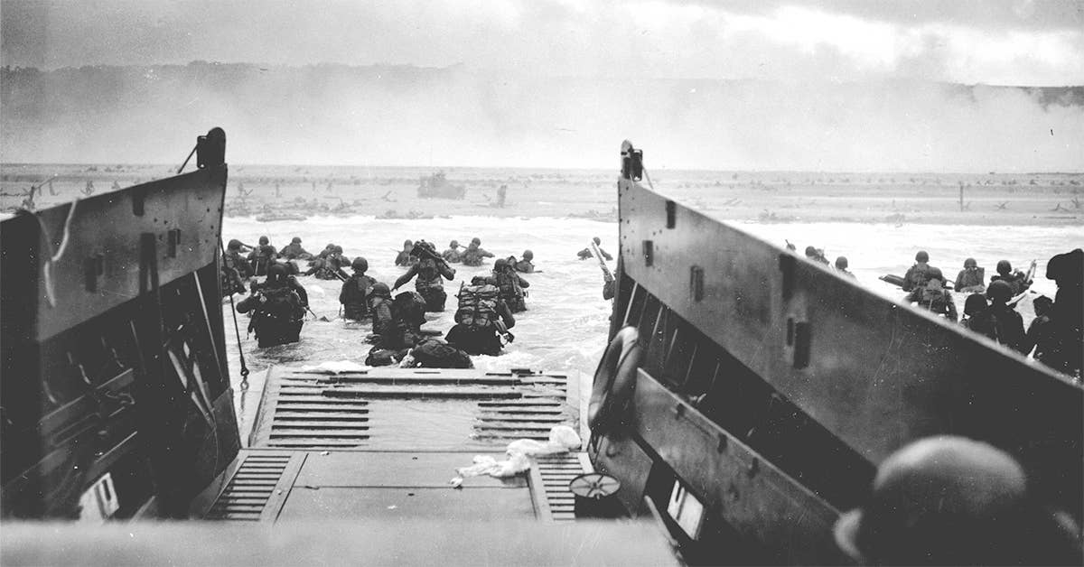 A Coast Guard-manned LCVP from the U.S.S. Samuel Chase disembarks troops on the morning of June 6, 1944 at Omaha Beach. (USCG photo by CPHOM Robert F. Sargent)