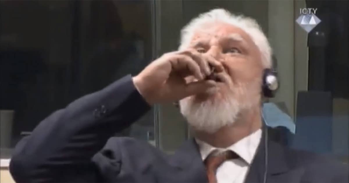 Convicted Croat war criminal Slobodan Praljak drinks poison. (Screengrab from ICTY video)