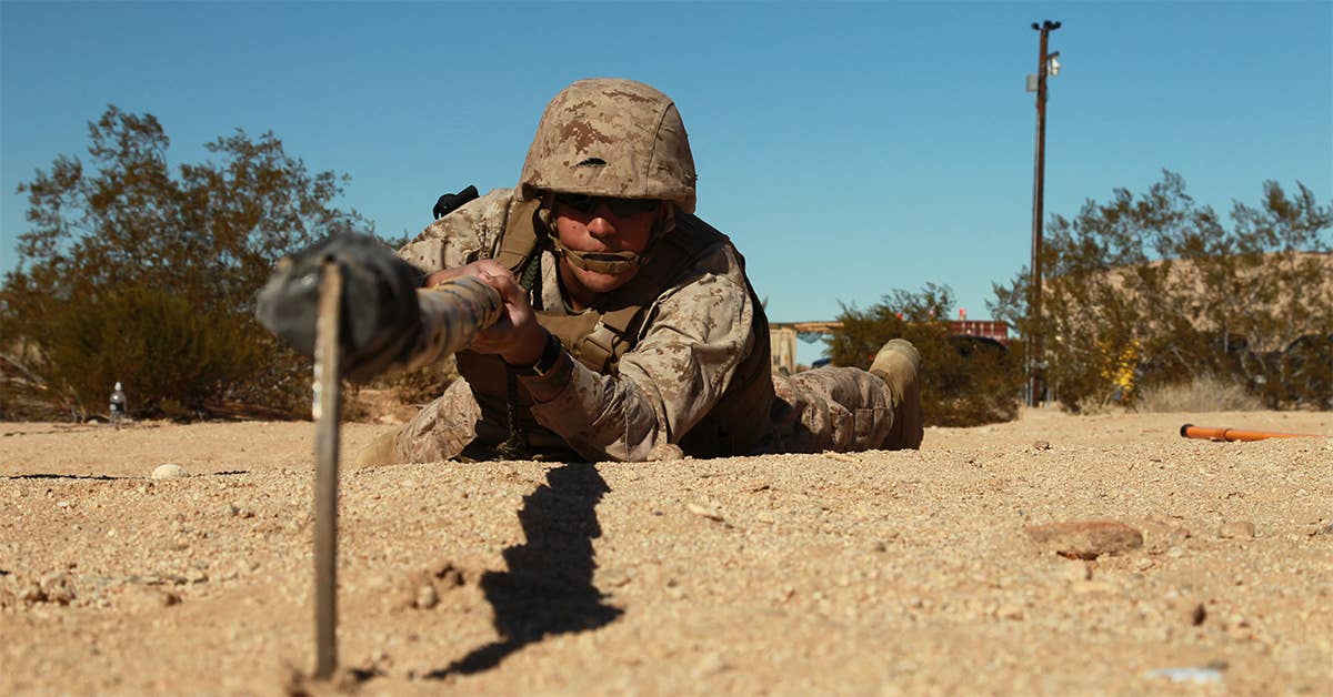 A Marine and his trusty scythe will never run out of batteries. (USMC photo by Cpl. William J. Jackson)