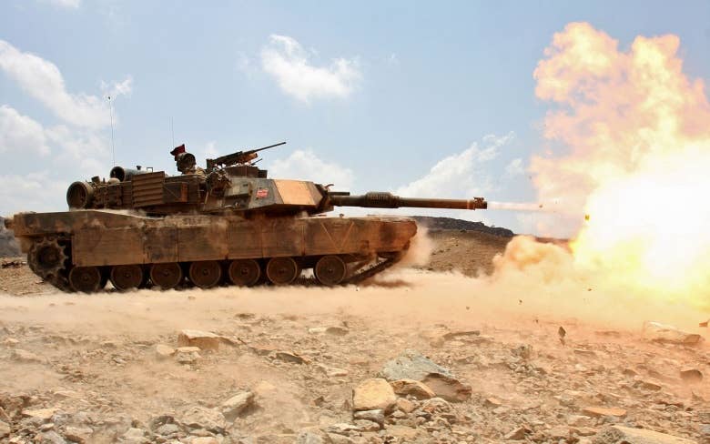 M1A1 Abrams firing its massive main cannon.