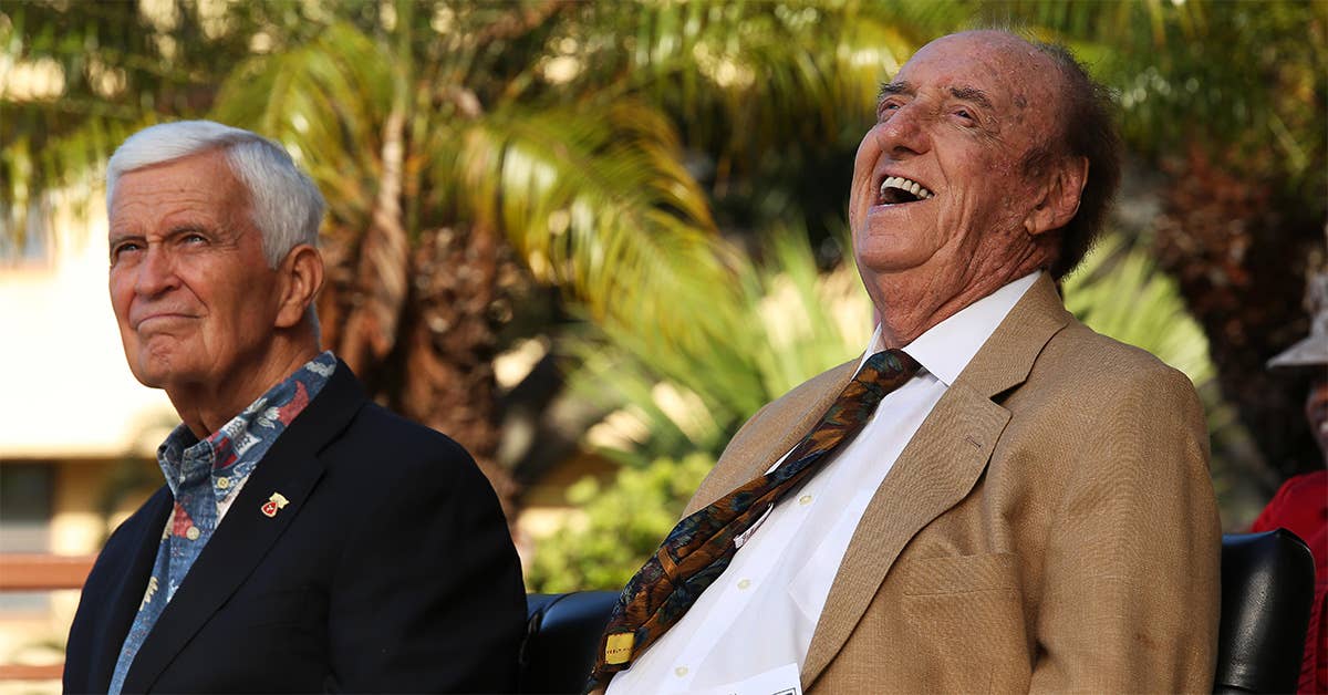 Jim Nabors (right), honorary Marine sergeant who played Gomer Pyle in a television show laughs while his biography is read during a conference room dedication ceremony at Camp H. M. Smith, Hawaii, June 9, 2015. Nabors laughed when his biography stated he was given the rank of private for 37 years before being awarded honorary lance corporal. (U.S. Marine Corps photo by Sgt. Sarah Anderson)
