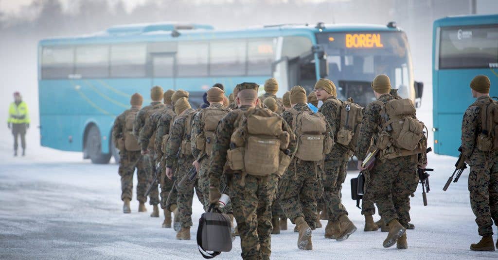US Marines with Black Sea Rotational Force 17.1 prepare to board a bus after arriving in Vaernes, Norway, Jan. 16, 2017. The Marines are part of the newly established Marine Rotational Force-Europe, and will be training with the Norwegian Armed Forces to improve interoperability and enhance their ability to conduct operations in Arctic conditions. (USMC photo by Sgt. Erik Estrada.)