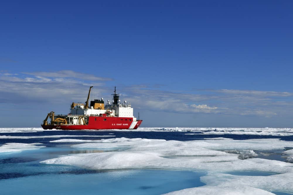 The Coast Guard Cutter Healy, a medium icebreaker, sits in the Chukchi Sea off the coast of Alaska during an Arctic deployment in support of scientific research and polar operations. (Image from DVIDS)