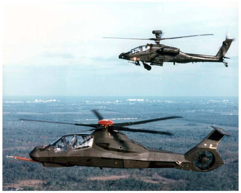 A RAH-66 Comanche prototype flies with an AH-64 Apache. (Photo: U.S. Army)
