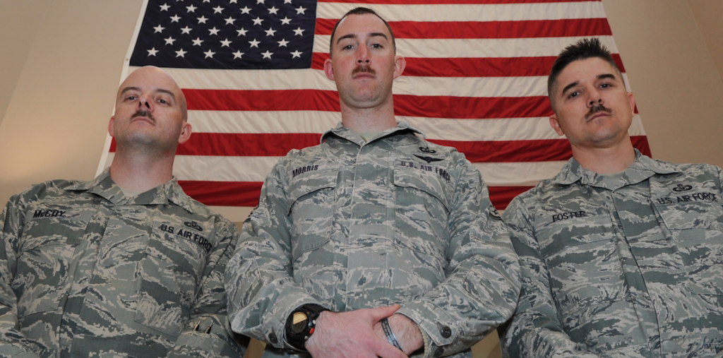 Master Sgt. Bryan McCoy, Staff Sgt. Clayton Morris, and Master Sgt. Anthony Foster show off their whiskers that were grown for Mustache March, March 27, 2014, at Dover Air Force Base, Del. (U.S. Air Force photo: Airman 1st Class Zachary Cacicia)