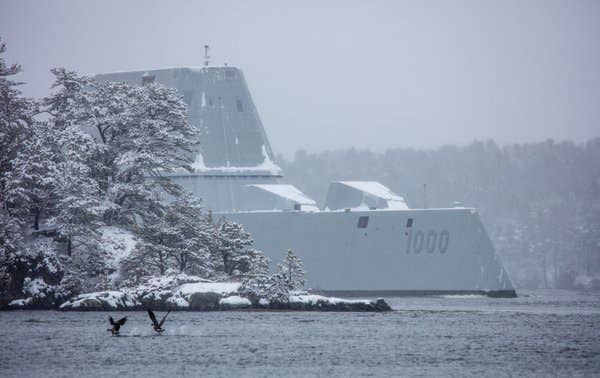 USS Zumwalt (DDG 1000) emerges past a point. (US Navy photo)