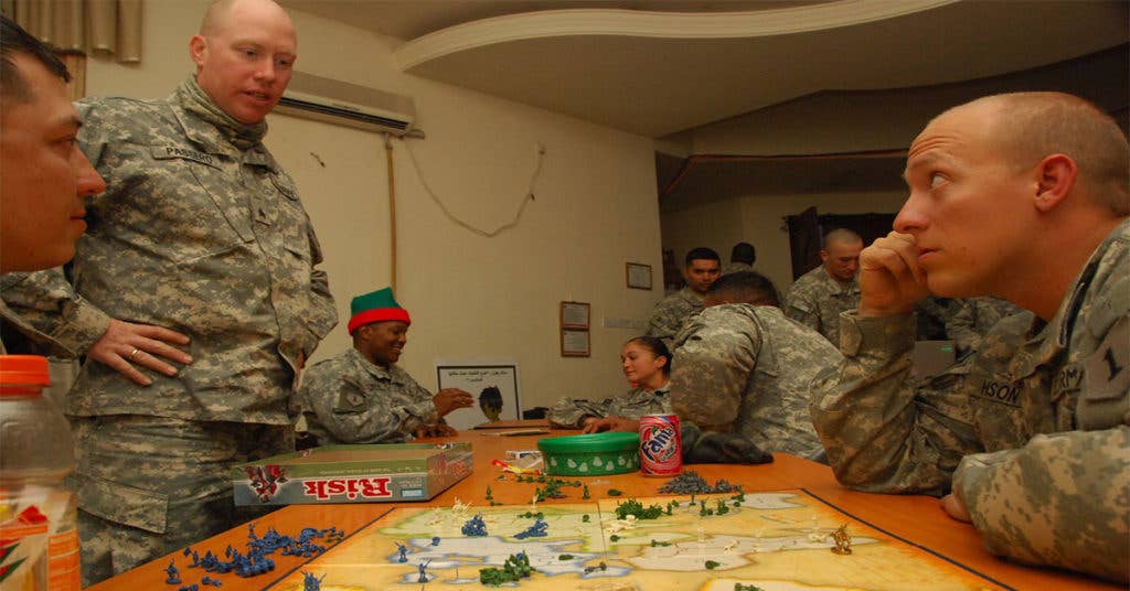 Soldiers playing Risk.