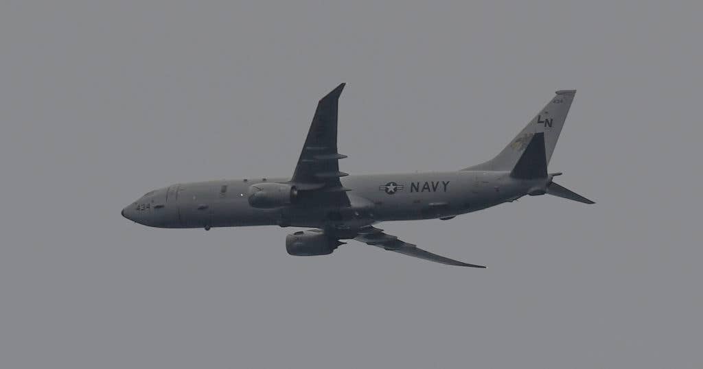 A P-8A Poseidon assigned to commander, Task Force 67 participates in a photo exercise during Exercise Dynamic Manta 2017. The annual multilateral Allied Maritime Command exercise meant to develop interoperability and proficiency in anti-submarine and anti-surface warfare. (U.S. Navy photo by Mass Communication Specialist 3rd Class Ford Williams/Released)